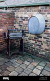 tin-bath-and-washing-mangle-in-back-yard-C4237J.jpg