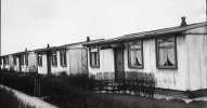 0_A-row-of-prefab-housing-in-Camberley-Road-Hough-End-Estate-Manchester-March-1954.jpg