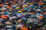 supporters-of-pita-limjaroenrat-are-seen-gathering-under-the-rain-during-the-demonstration-at.jpg