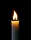 lit-candle-black-background-close-up-lit-candle-black-background-123363314.jpg