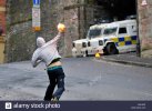 a-masked-nationalist-youth-prepares-to-throw-a-petrol-bomb-at-psni-C9C42W.jpg