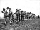 a-bibb-county-chain-gang-with-picks-and-shovels-returns-from-work-for-the-day-macon-georgia.jpg a-bibb-county-chain-gang-with-picks-and-shovels-returns-from-work-for-the-day-macon-georgia.jpg